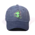 Washed dark blue denim baseball cap featuring a green alien embroidery on the front - Navy Blue