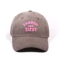 Vintage washed dark grey denim baseball cap featuring pink TANNED AND TIPSY embroidery - One Size / Coffee