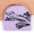 Street style lavender knit beanie featuring a black jacquard frog pattern and soft texture - One Size / Light Purple
