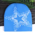 Blue knit beanie featuring a white pixelated star pattern for street style and winter warmth - One Size / Teal