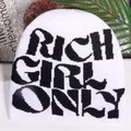 White street style knit beanie featuring black RICH GIRL ONLY lettering design - White