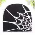 Y2K style black knitted beanie with a white spider web pattern for winter wear - One Size / Black and White