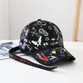 Black street style baseball cap with graffiti prints and long branded strap details - Sunflower Brim Graffiti-Black