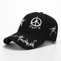 Black street style graffiti baseball cap with white print patterns and fashion lettering - All Black Star