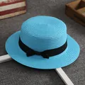 Flat top straw boater hat in light blue with a black grosgrain ribbon bow decoration - Sky Blue
