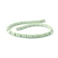 Macro shot of light green lava stone cylinder beads showing porous texture for DIY jewelry - Light Green (No.7)