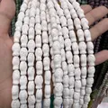 Perle in pietra vulcanica bianca a forma di pesce per la creazione di gioielli fai da te - Bianco