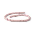 Macro detail of cylindrical pink volcanic stone beads with natural porous texture for DIY - Light Pink (No.17)