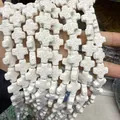 Perles en forme de croix blanche en pierre de lave poreuse pour bijoux DIY - Blanc