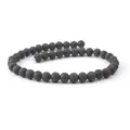Dettaglio macro di perle in pietra lavica nera naturale con trama porosa per gioielli - XXS / Nero