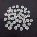 Detailed macro shot of white shell daisy beads with green center for DIY jewelry - Green