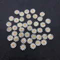 Macro detail of white daisy shell beads with yellow core for DIY jewelry making - Yellow
