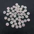 Macro shot of white daisy shell beads with pink centers for DIY jewelry making accessories - Pink