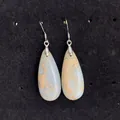 Macro shot of Bohemian waterdrop natural imperial stone earrings on black velvet - Gray Blue Brown (15)