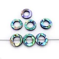 Natuurlijke abalone schelp donut kralen met levendige blauwe en groene glans - Ring