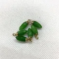 Set of five green faceted bullet-shaped jade stone pendants with gold metal caps - Green Jade
