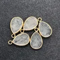 Cinq pendentifs goutte en pierre naturelle transparente facettée avec bordure dorée - 14x23mm / Cristal blanc