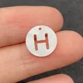 Perle ronde en nacre naturelle avec lettre H évidée pour création de bijoux - Lettre H
