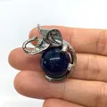 Silver elephant pendant with deep blue sparkling sandstone bead held in hand - 21x32mm / Blue Sandstone