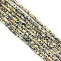 Macro shot of natural Dalmatian Jasper cylinder stone beads for DIY jewelry making - Dalmatian Jasper