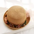 Light brown woven sun hat with multi-color floral ribbon and pink mesh bow accent - Khaki
