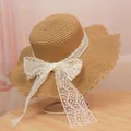 Women's woven straw sun hat with large wavy brim and wide white lace bow detail - M / Lace Style (Lace Bow) / Khaki