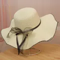 Women's wide brim straw sun hat in cream white with black bow and wavy edge details - M / Diagonal Line Style (Polka Dot Ribbon Bow) / Cream
