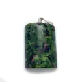 Polished ruby in zoisite barrel shaped stone pendant with a silver metal clasp - Ruby Zoisite