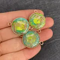 Close-up of three circular turquoise connectors with 18K gold frames for DIY jewelry making - No.1 (Green Marble Pattern) / 22x30mm