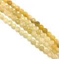 Macro shot of faceted yellow citrine quartz gemstone beads for DIY jewelry making - 8x8x5mm (Approx 25 Pieces) / Topaz