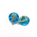 Macro view of blue faceted crystal round pendants with golden rose floral metal accents - Size 5 / 14mm Thick 10mm Long (50 Pieces/pack)