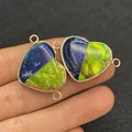 Close-up of heart-shaped turquoise stone pendant connectors held between fingers - Blue-Green Two-Tone Spliced Imperial Stone Heart Style (23)