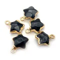 Detailed view of five-pointed star charms with black faceted texture and gold plating - 13x16mm / Black Agate