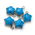 Macro detail of star-shaped turquoise pendants with silver plating and metal rings - 13x16mm / Blue Turquoise