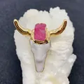 Detail of bull head pendant with gold horns and pink druzy stone on a white stone base - Pink Druzy Style (No. 1)