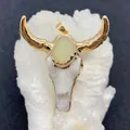 Macro detail of bull skull pendant with yellow crystal druzy and gold-plated horns - Light Green Druzy Style (No. 2)
