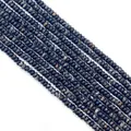 Gros plan de perles rondelles en pierre impériale noire avec motifs marbrés pour bijoux DIY - Noir