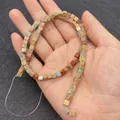 4mm cube natural imperial stone beads in mixed colors on a hand for DIY jewelry - Multicolor Mixed Stone Texture Cube (No.3)