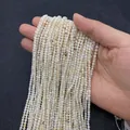 Strands of creamy white round shell beads with iridescent luster for DIY jewelry making - 4mm / Shell