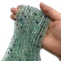 Faceted natural fluorite 2-4mm round beads in light green and purple colors - Green Fluorite