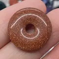 Polished brown goldstone donut pendant with shimmering gold speckles for DIY jewelry - Gold Sandstone