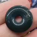 Green onyx stone donut pendant charm with 20mm diameter shown held by fingers - Dark Green Jade (No.5)