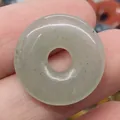Natural light green stone donut pendant with central hole and unique mineral inclusions - Light Green Jade (No.20)