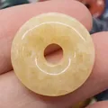 Handcrafted yellow natural stone donut pendant with unique internal crystal textures - Topaz