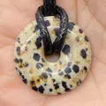 Dalmatian stone donut pendant with black spots on a woven cord, 20mm round stone charm - Dalmatian Jasper