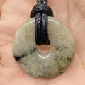 Natural round stone pendant with unique black mineral textures on a black woven cord - Stone With Inclusions (No.12)