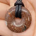 Red jasper stone donut pendant with natural mottled textures on a black woven cord - Grass Flower Stone (No.14)
