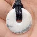 White turquoise stone ring pendant with natural grey veins on a black braided cord - Howlite
