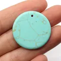 Flat round blue turquoise stone pendant with natural brown veins and a center hole - Blue Turquoise