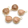 Five faceted teardrop sunstone pendants with gold plated edges and integrated metal loops - Orange Pink Moonstone (No. 11)